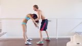 Strong sports man is banging the flexible brunette with passion. She is deepthroating his massive boner and getting punished in the white bed.